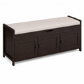 Banco de madera oscuro con coj¨ªn beige y alma